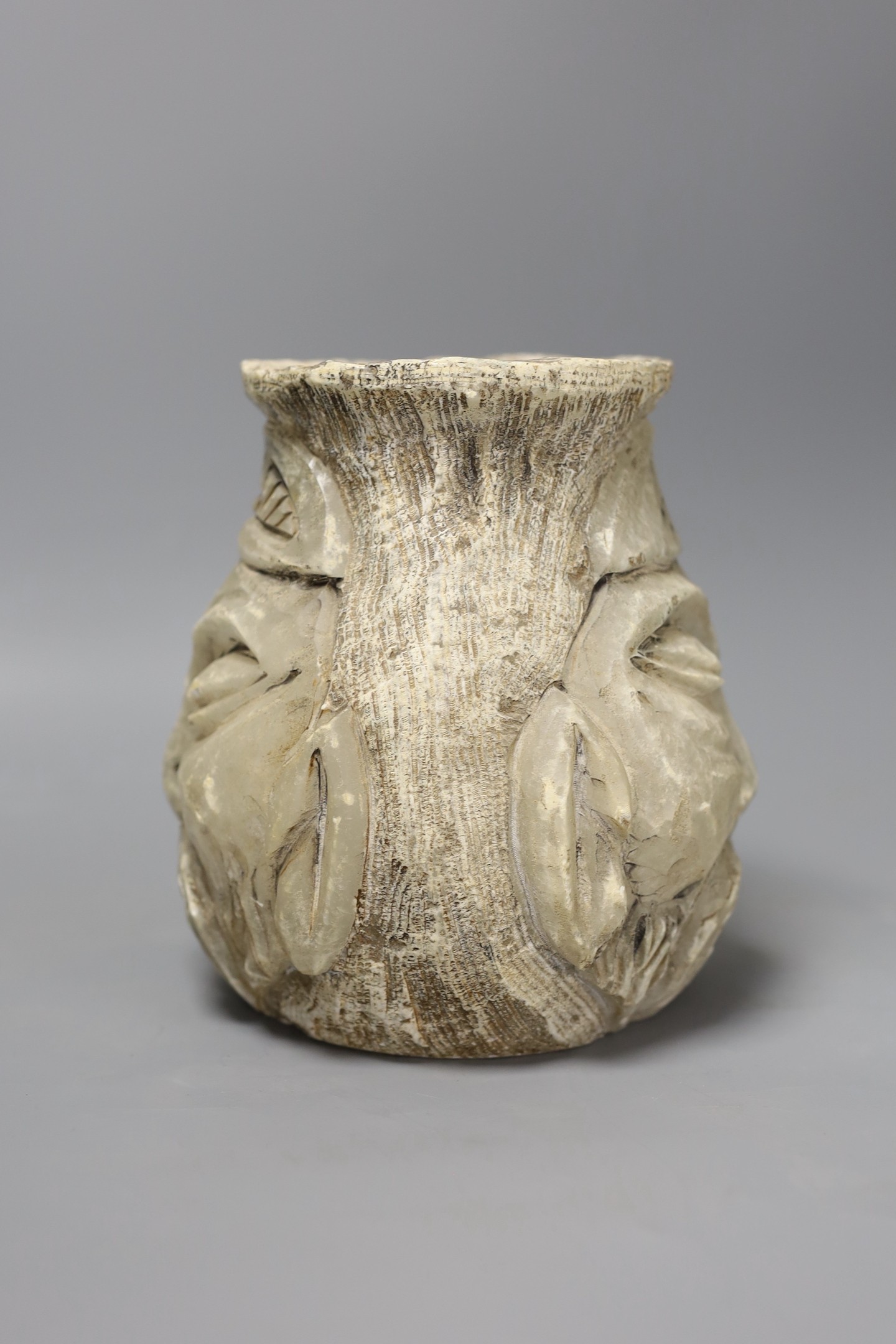 A carved alabaster twin face vase, signed, 18 cms high